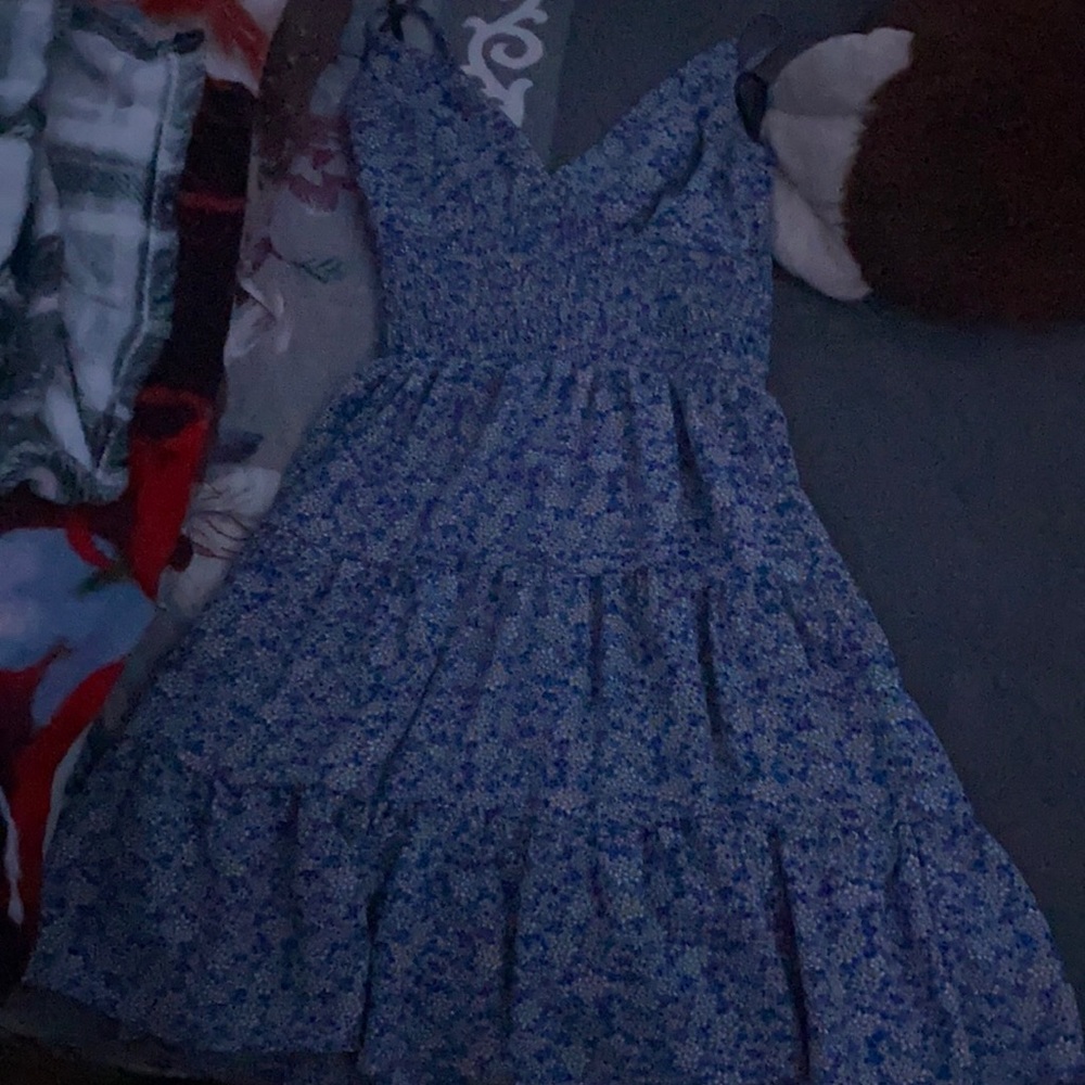 This dress is blue with flowers and is so nice.
